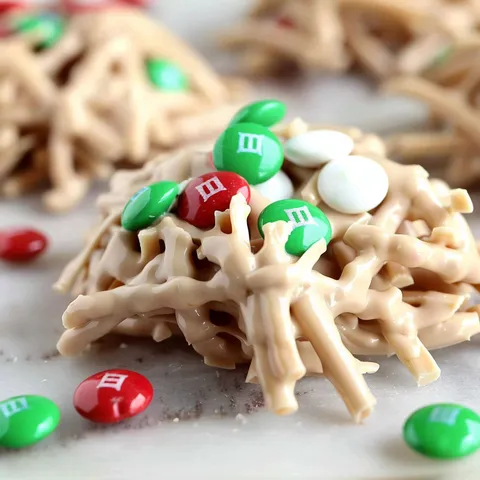 A close up of a holiday haystack with marshmallows and M&M's.