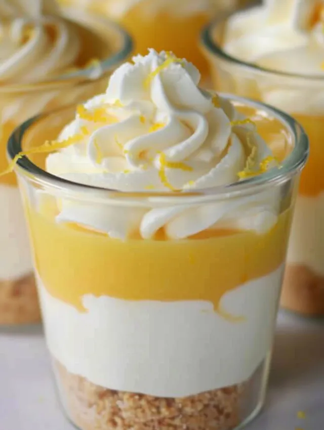 A glass of lemon parfait with whipped cream.