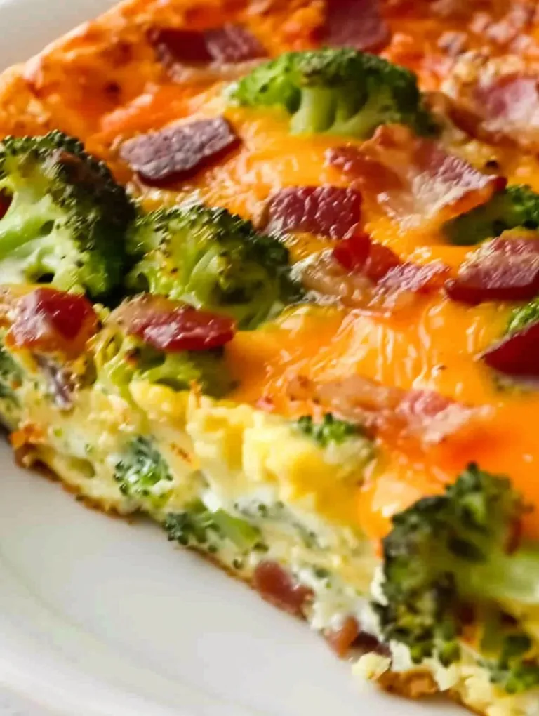 A slice of a keto overnight breakfast casserole with broccoli.