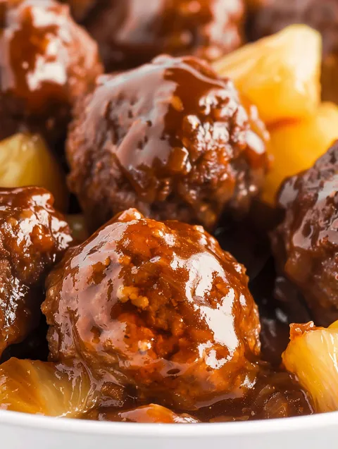 Sweet and sour meatballs with a brown sauce.